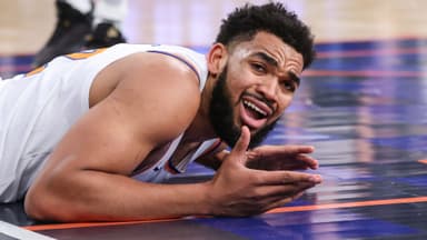 Jan 21, 2026; New York, New York, USA; New York Knicks center Karl-Anthony Towns (32) reacts after geting called for an offensive foul in the second quarter against the Brooklyn Nets at Madison Square Garden