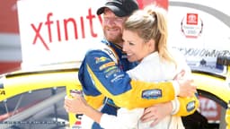 Apr 23, 2016; Richmond, VA, USA; Xfinity Series driver Dale Earnhardt Jr. (88) celebrates with his fianc Amy Reimann in Victory Lane after winning the Toyotacare 250 at Richmond International Raceway.