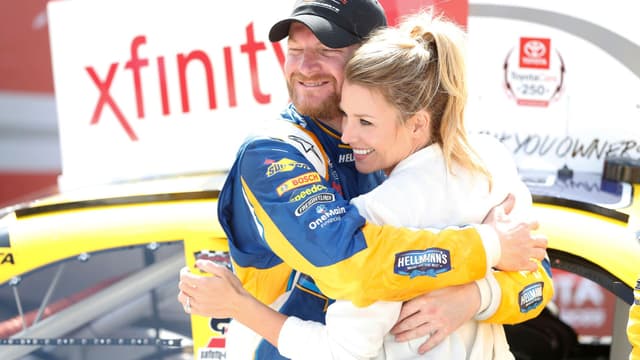 Apr 23, 2016; Richmond, VA, USA; Xfinity Series driver Dale Earnhardt Jr. (88) celebrates with his fianc Amy Reimann in Victory Lane after winning the Toyotacare 250 at Richmond International Raceway.
