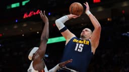Denver Nuggets center Nikola Jokic (15) shoots the basketball over Miami Heat center Bam Adebayo (13) during the first quarter at Kaseya Center