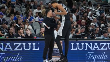 Dec 31, 2025; San Antonio, Texas, USA; San Antonio Spurs head coach Mitch Johnson talks with forward Victor Wembanyama (1) in the second half against the New York Knicks at Frost Bank Center