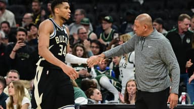 Apr 27, 2025; Milwaukee, Wisconsin, USA; Milwaukee Bucks forward Giannis Antetokounmpo (34) exits the game in the fourth quarter as head coach Doc Rivers shakes his hand during game four against the Indiana Pacers of first round for the 2024 NBA Playoffs at Fiserv Forum.