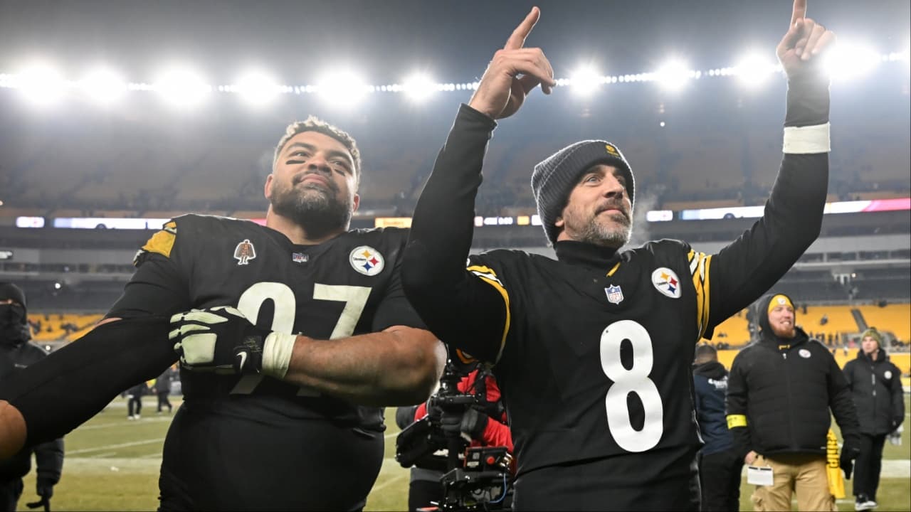 Pittsburgh Steelers quarterback Aaron Rodgers (8) and defensive tackle Cameron Heyward (97) celebrate after defeating the Baltimore Ravens at Acrisure Stadium.