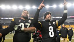 Pittsburgh Steelers quarterback Aaron Rodgers (8) and defensive tackle Cameron Heyward (97) celebrate after defeating the Baltimore Ravens at Acrisure Stadium.