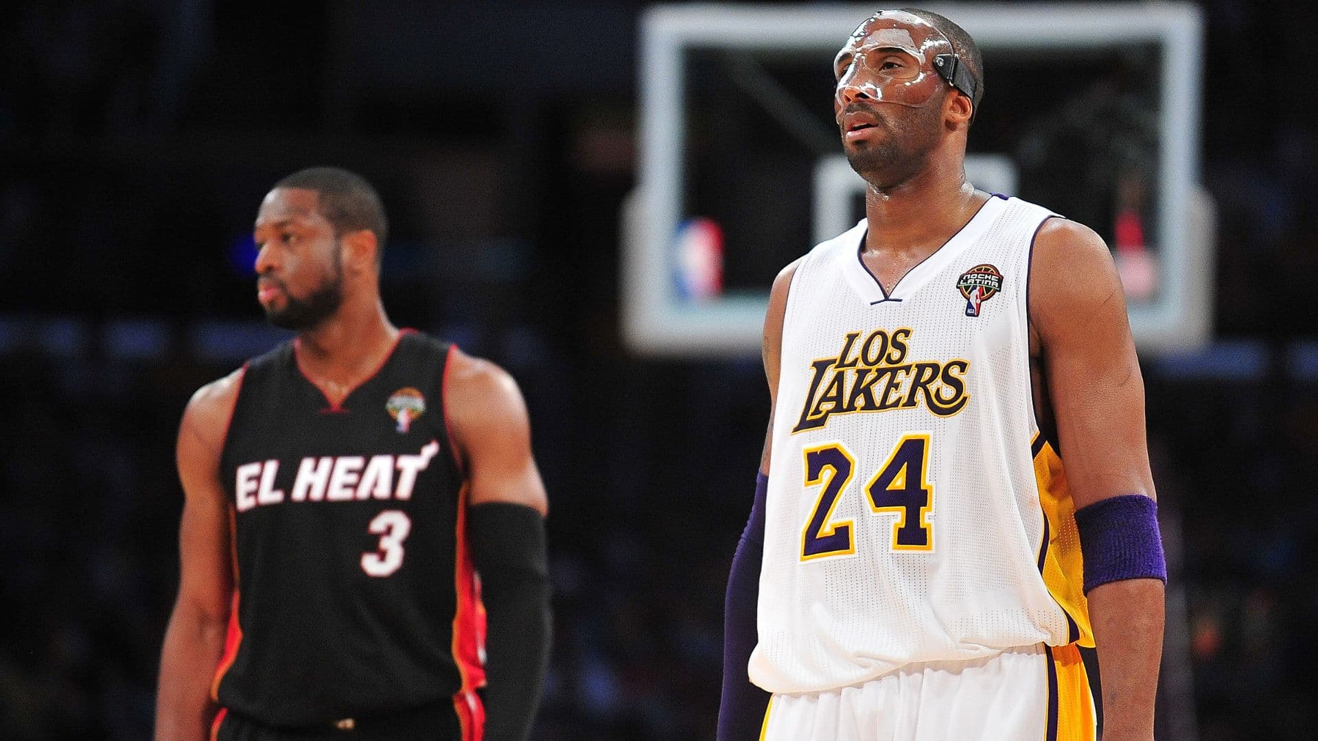 March 4, 2012; Los Angeles, CA, USA; Los Angeles Lakers shooting guard Kobe Bryant (24) and Miami Heat shooting guard Dwyane Wade (3) during a stoppage in play in the first half at Staples Center