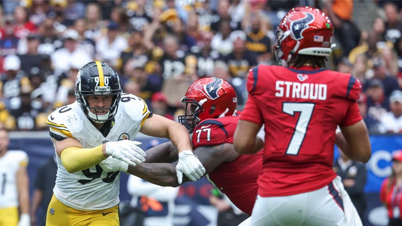 Houston Texans offensive tackle George Fant (77) attempts to block Pittsburgh Steelers linebacker T.J. Watt (90) as Texans quarterback C.J. Stroud (7) looks for an open receiver during the third quarter at NRG Stadium.