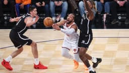 New York Knicks guard Jalen Brunson (11) looks to drive past Brooklyn Nets forward Noah Clowney (21) and guard Egor Demin (8) in the first quarter at Madison Square Garden