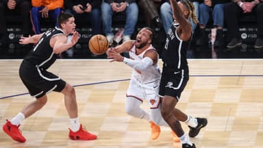 New York Knicks guard Jalen Brunson (11) looks to drive past Brooklyn Nets forward Noah Clowney (21) and guard Egor Demin (8) in the first quarter at Madison Square Garden