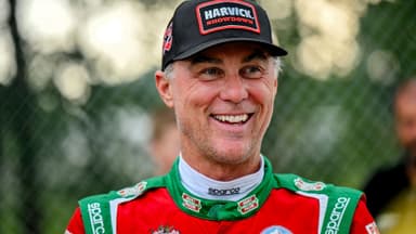 Former NASCAR Cup Series champion Kevin Harvick smiles during an autograph session before the 13th annual Masters of the Pros 200 race on Wednesday, July 16, 2025, at the Owosso Speedway.