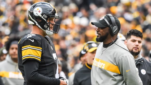 Pittsburgh Steelers head coach Mike Tomlin talks with quarterback Ben Roethlisberger (7) during the second quarter against the Cleveland Browns at Heinz Field.