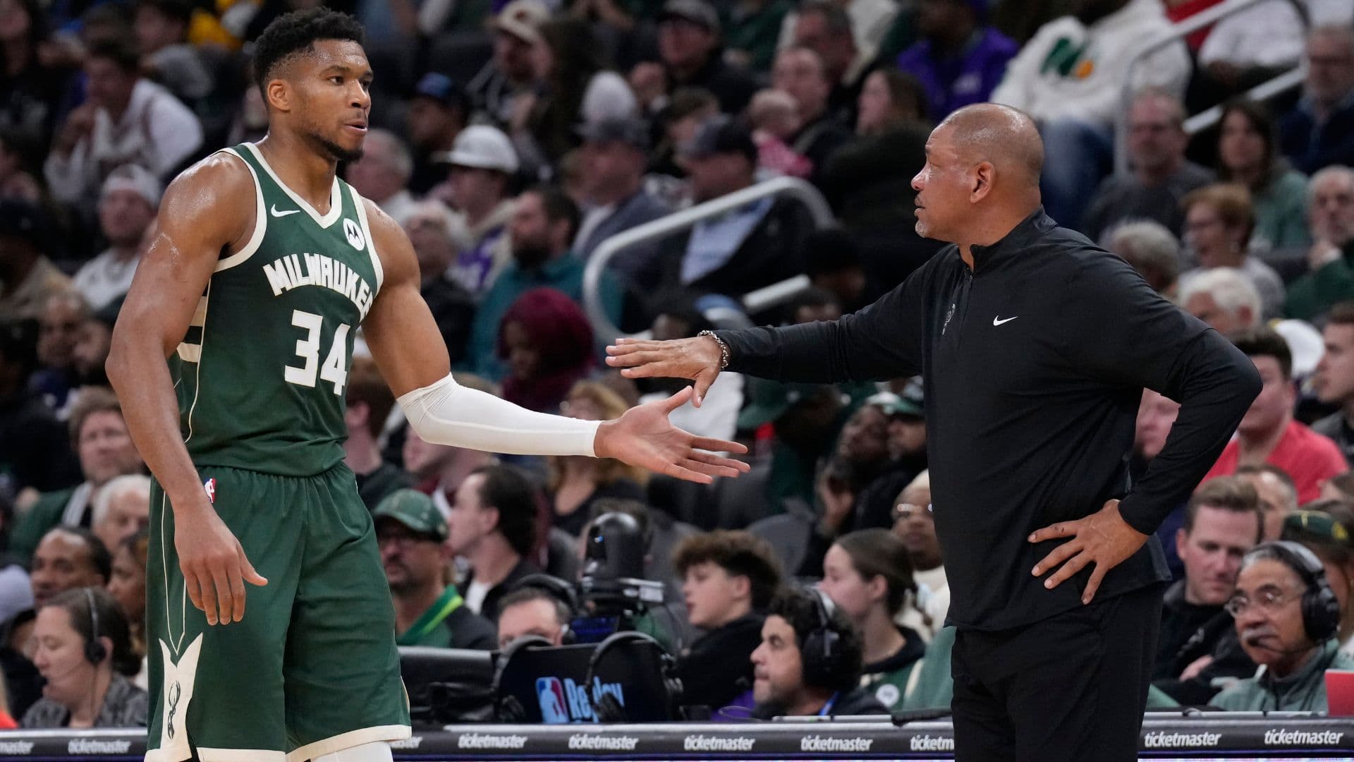 Oct 25, 2024; Milwaukee, Wisconsin, USA; Milwaukee Bucks head coach Doc Rivers takes Milwaukee Bucks forward Giannis Antetokounmpo (34) out of the game in the fourth quarter against the Chicago Bulls at Fiserv Forum