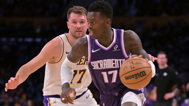 Sacramento Kings guard Dennis Schroder (17) drives past Los Angeles Lakers guard Luka Doncic (77) in the first half at Crypto.com Arena.