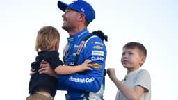 Nov 2, 2025; Avondale, Arizona, USA; NASCAR Cup Series driver Kyle Larson (5) celebrates his championship victory with son Cooper and Owen following the Cup Series Championship race at Phoenix Raceway