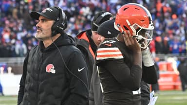 Cleveland Browns head coach Kevin Stefanski and quarterback Shedeur Sanders (12) on the sidelines against the Buffalo Bills during the second half at Huntington Bank Field.