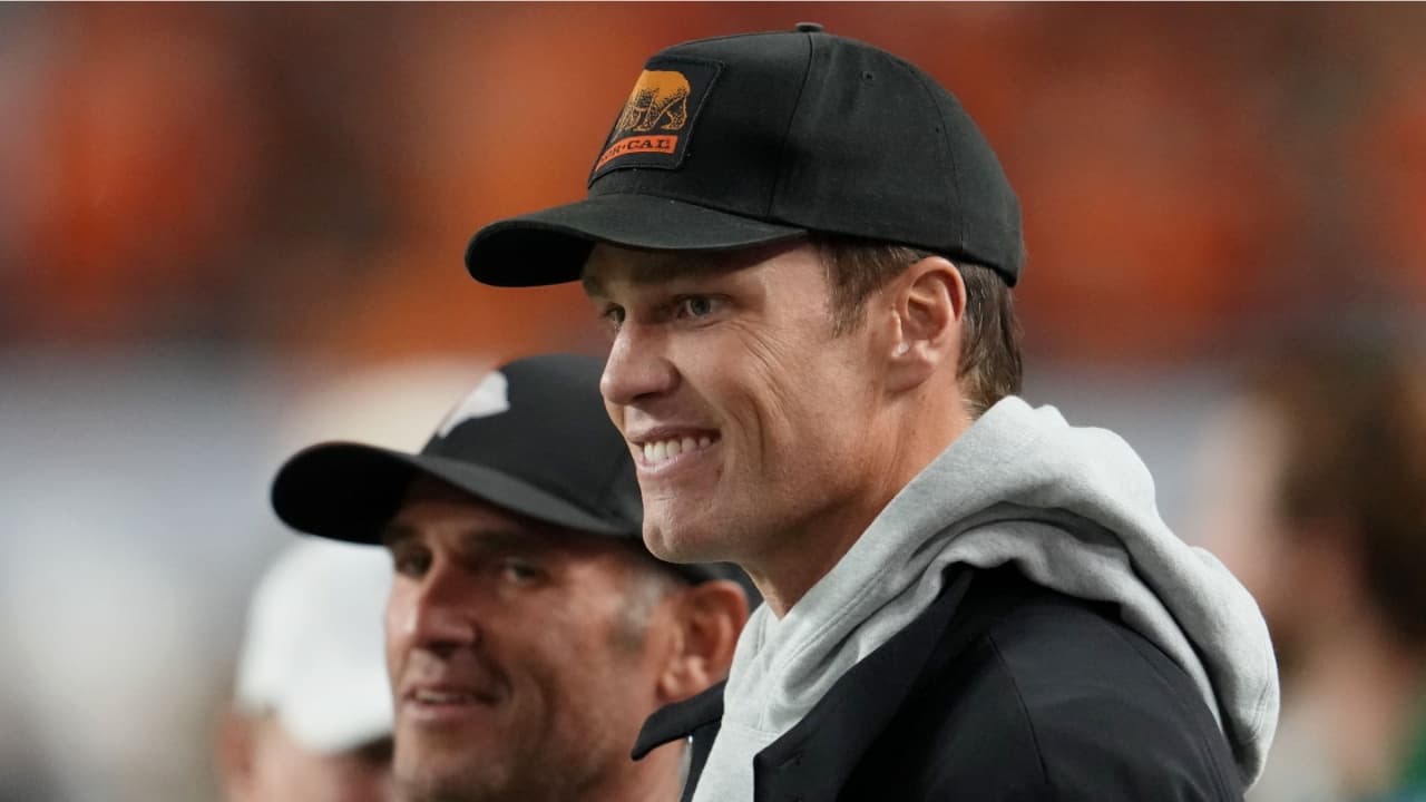 Tom Brady looks on from the sideline before the CFP National Championship college football game between the Indiana Hoosiers and the Miami Hurricanes at Hard Rock Stadium.