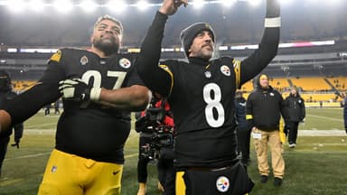 Pittsburgh Steelers quarterback Aaron Rodgers (8) and defensive tackle Cameron Heyward (97) celebrate after defeating the Baltimore Ravens at Acrisure Stadium.