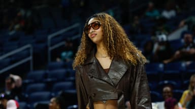 Sep 11, 2025; Chicago, Illinois, USA; Injured Chicago Sky forward Angel Reese (5) stands on the sidelines before a WNBA game against the New York Liberty at Wintrust Arena.