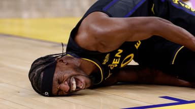 Golden State Warriors forward Jimmy Butler III (10)he goes down with a knee injury during the third quarter against the Miami Heat at Chase Center.