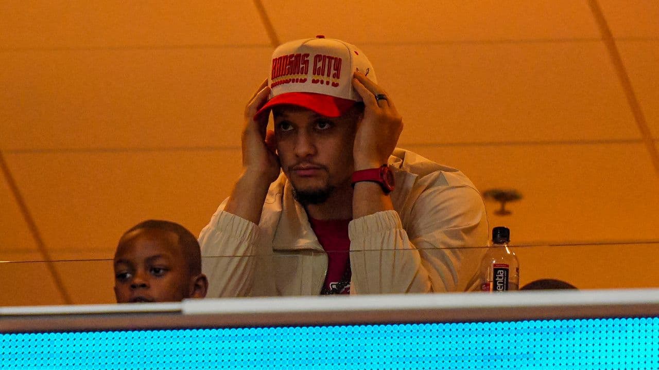Patrick Mahomes watches the action from a suite during the third quarter at GEHA Field at Arrowhead Stadium.