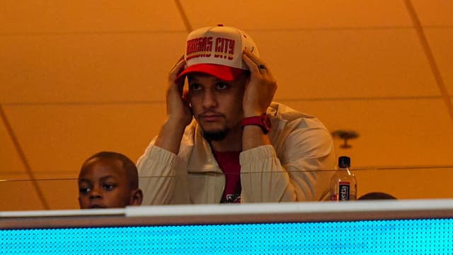 Patrick Mahomes watches the action from a suite during the third quarter at GEHA Field at Arrowhead Stadium.
