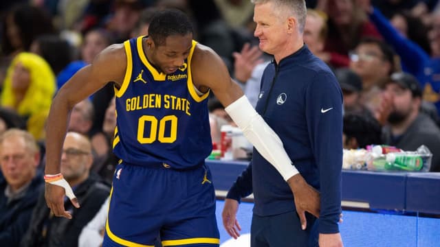 Jan 25, 2024; San Francisco, California, USA; Golden State Warriors forward Jonathan Kuminga (00) reacts after a foul with head coach Steve Kerr against the Sacramento Kings during the second quarter at Chase Center