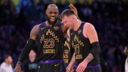 Los Angeles Lakers forward LeBron James (23) and Los Angeles Lakers guard Luka Doncic (77) walk to the bench during a time out in the second half at Crypto.com Arena.