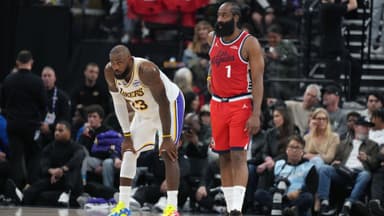 Dec 20, 2025; Inglewood, California, USA; Los Angeles Lakers forward Lebron James (23) and LA Clippers guard James Harden (1) react in the first half at Intuit Dome.