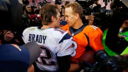 Denver Broncos quarterback Peyton Manning (18) greets New England Patriots quarterback Tom Brady (12) after the AFC Championship football game at Sports Authority Field at Mile High.