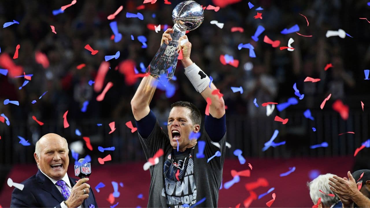 New England Patriots quarterback Tom Brady celebrates with the Vince Lombardi Trophy after defeating the Atlanta Falcons 34-38 in Super Bowl LI at NRG Stadium.
