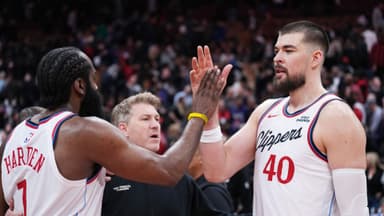 Jan 16, 2026; Toronto, Ontario, CAN; LA Clippers guard James Harden (1) celebrates the win with center Ivica Zubac (40) against the Toronto Raptor at the end of the overtime period at Scotiabank Arena