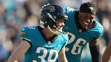 Jacksonville Jaguars placekicker Cam Little (39) celebrates with safety Antonio Johnson (26) after kicking a sixty-seven yard field goal against the Tennessee Titans during the second quarter at EverBank Stadium.