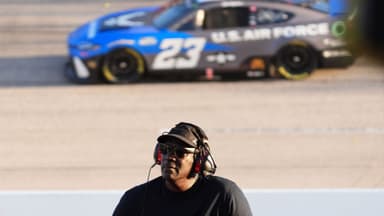 Sep 1, 2024; Darlington, South Carolina, USA; NASCAR Cup Series Team 23XI owner Michael Jordan watches a video board as NASCAR Cup Series driver Bubba Wallace (23) races during the Cook Out Southern 500 at Darlington Raceway.
