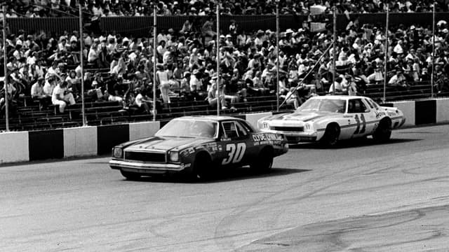 Cale Yarborough (11) attempts to get around Walter Ballard (30) during the Nashville 420 Grand National race at Nashville Speedway on July 20, 1975. Yarborough went on to finished a full one and one-quarter laps ahead of second place Richard Petty before a crowd of 16,500.