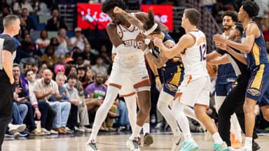 Dec 27, 2025; New Orleans, Louisiana, USA; New Orleans Pelicans guard Jose Alvarado (15) gets into a scrum with Phoenix Suns center Mark Williams (15) over a play during the second half at Smoothie King Center