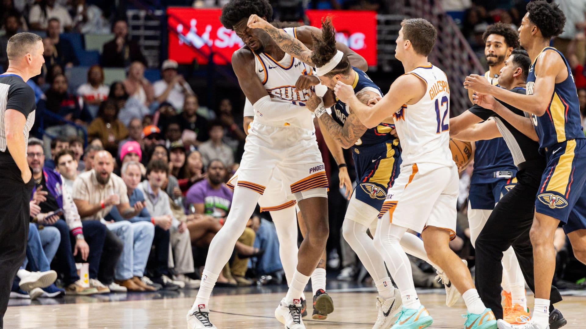 Dec 27, 2025; New Orleans, Louisiana, USA; New Orleans Pelicans guard Jose Alvarado (15) gets into a scrum with Phoenix Suns center Mark Williams (15) over a play during the second half at Smoothie King Center