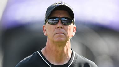 Baltimore Ravens offensive coordinator Todd Monken on the field before the game against the Washington Commanders at M&T Bank Stadium.