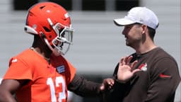Browns quarterback Shedeur Sanders works with offensive coordinator Tommy Rees during rookie minicamp May 9, 2025, in Berea.