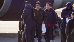 Patriots players board the team jet for Denver on Saturday, Jan. 24, at Rhode Island T.F. Green International Airport in Warwick.