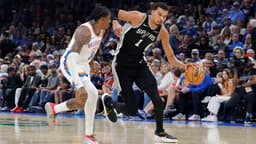 Dec 25, 2025; Oklahoma City, Oklahoma, USA; San Antonio Spurs forward Victor Wembanyama (1) drives down the court beside Oklahoma City Thunder guard Jalen Williams (8) during the second quarter at Paycom Center