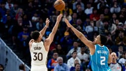 Golden State Warriors guard Stephen Curry (30) takes a three-point shot as Charlotte Hornets forward Grant Williams (2) defends during the third quarter at Chase Center