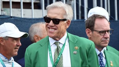 Former NFL player John Elway watches from the first hole tee box with other VIP guests before the opening ceremony during the first round of the BMW Championship golf tournament at Castle Pines Golf Club.