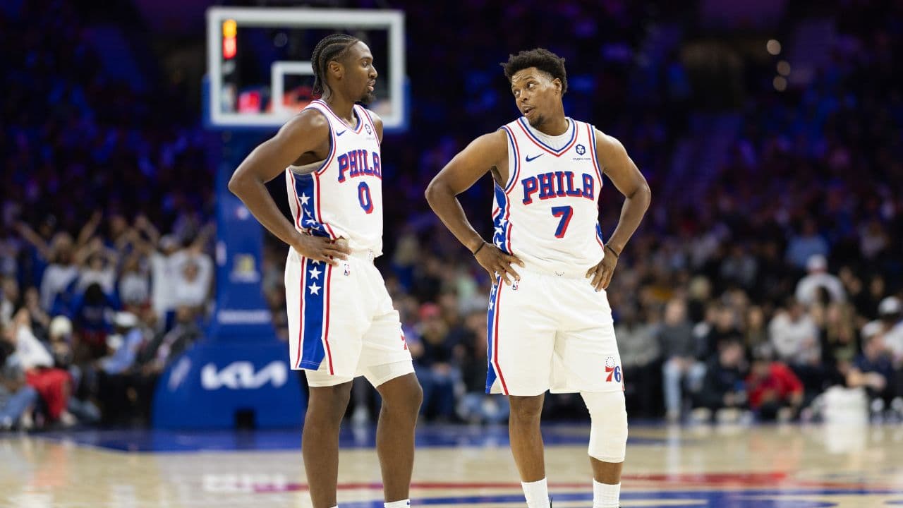 Philadelphia 76ers guard Tyrese Maxey (0) talks with guard Kyle Lowry (7) during the third quarter against the Memphis Grizzlies at Wells Fargo Center.