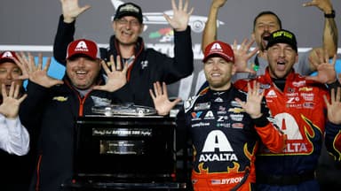 Feb 16, 2025; Daytona Beach, Florida, USA; NASCAR Cup Series driver William Byron (24) poses with the Harley J. Earl trophy after winning the Daytona 500 at Daytona International Speedway.