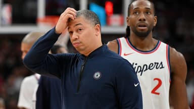 Los Angeles Clippers head coach Tyronn Lue scratches his head after calling a time out as forward Kawhi Leonard (2) walks past in the first half against the Toronto Raptors at Scotiabank Arena.