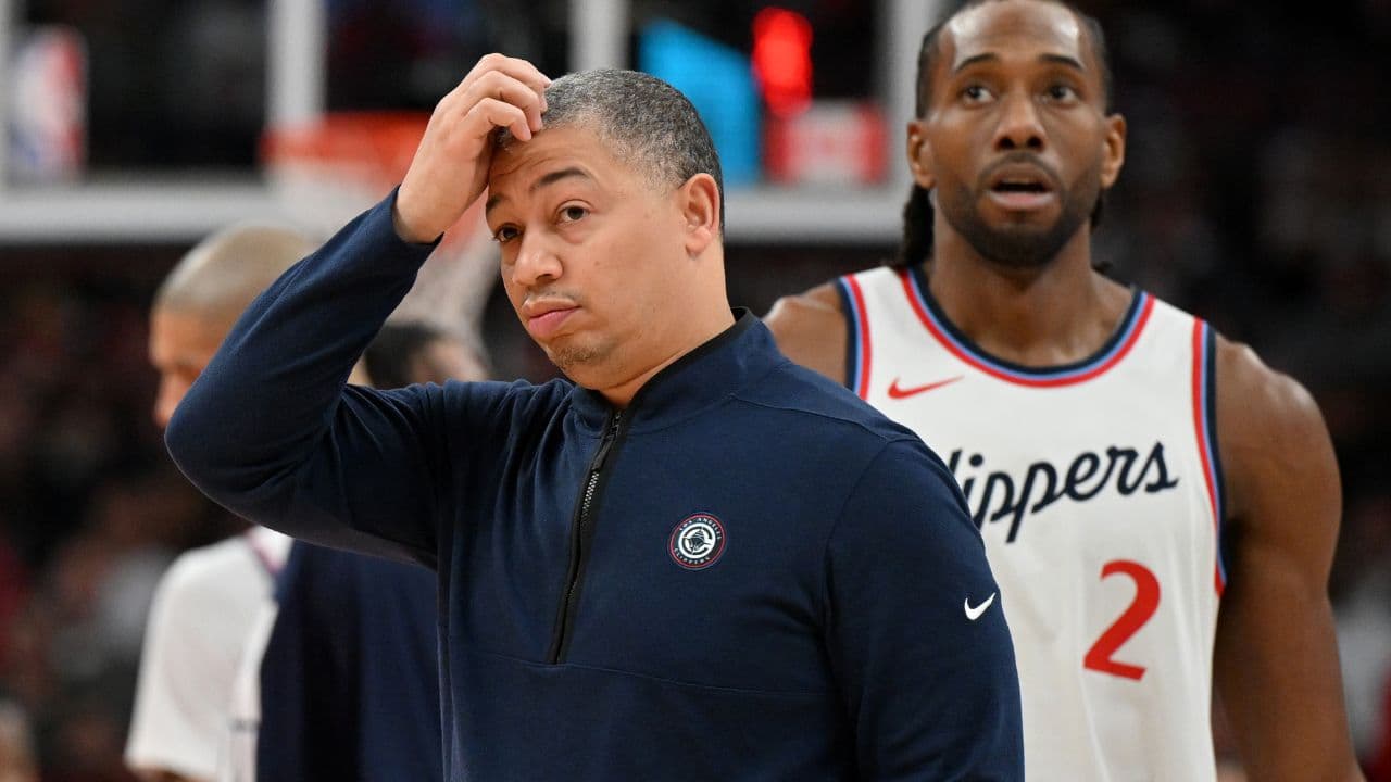 Los Angeles Clippers head coach Tyronn Lue scratches his head after calling a time out as forward Kawhi Leonard (2) walks past in the first half against the Toronto Raptors at Scotiabank Arena.