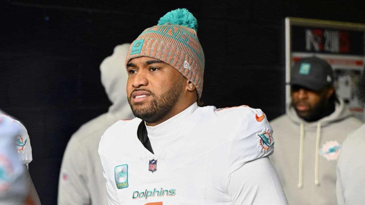 Miami Dolphins quarterback Tua Tagovailoa (1) walks out of the player tunnel before the game against the New England Patriots at Gillette Stadium.