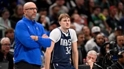 Dallas Mavericks head coach Jason Kidd and forward Cooper Flagg (32) look on during the game between the Mavericks and the 76ers at American Airlines Center.