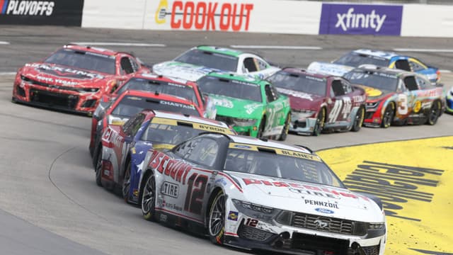 Oct 26, 2025; Martinsville, Virginia, USA; NASCAR Cup Series driver Ryan Blaney (12) leads during stage three of the Xfinity 500 at Martinsville Speedway