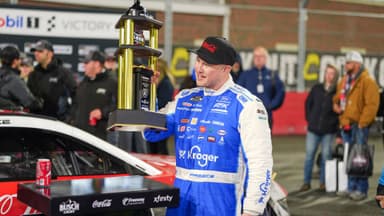 Feb 4, 2026; WInston-Salem, North Carolina, USA; NASCAR Cup Series driver Ryan Preece (60) holds the Bobby Allison Memorial Trophy after winning the Cook Out Clash at Bowman Gray Stadium