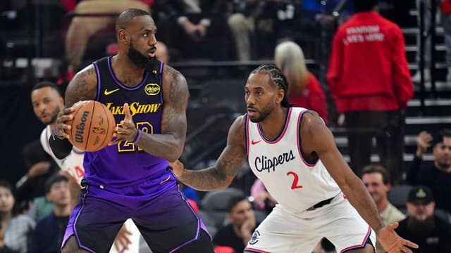 Los Angeles Lakers forward LeBron James (23) moves the ball against Los Angeles Clippers forward Kawhi Leonard (2) during the first half at Intuit Dome.